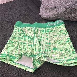 Nike Green and White Athletic Shorts with Web-Like Design